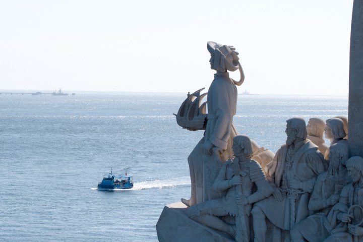 a group of people in a boat on a body of water