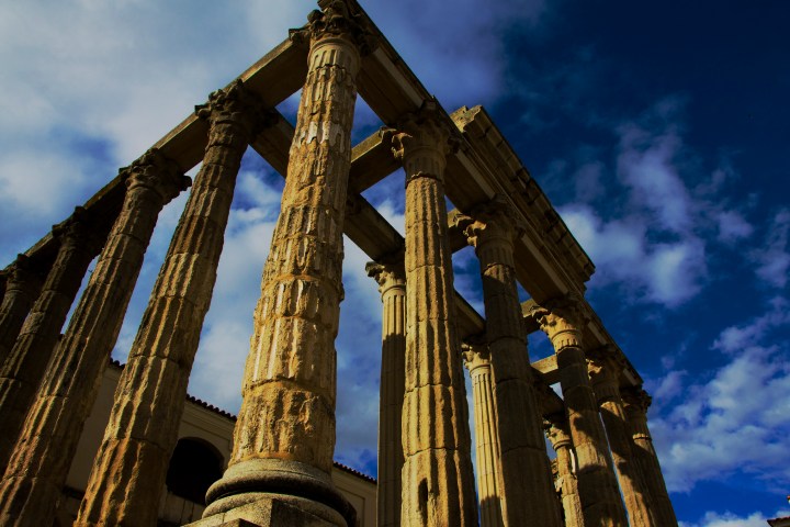 a large tall tower with a clock at the top of a building
