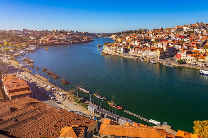 a large body of water with a city in the background