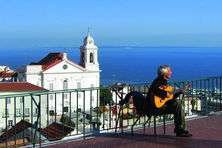 a person standing in front of a fence