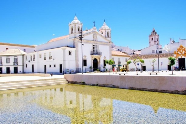 a building next to a body of water