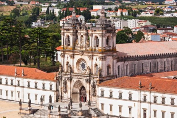 a large clock tower towering over a city