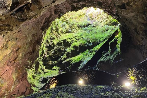 a waterfall with trees in the background