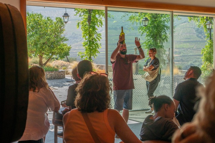 a group of people sitting in front of a window