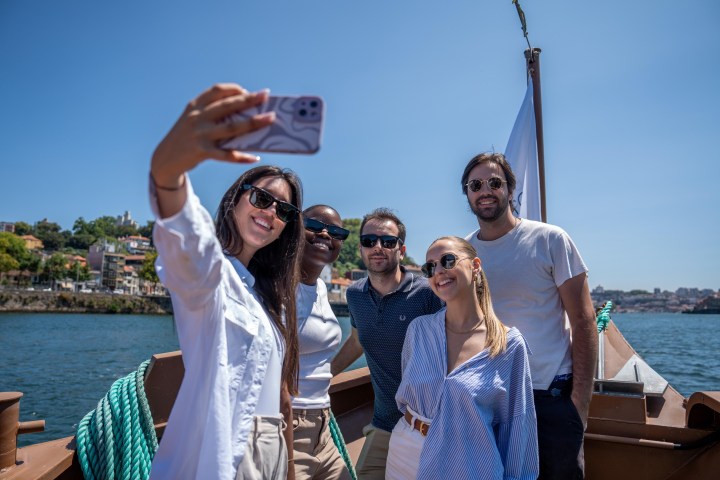 a couple of people that are standing in a body of water