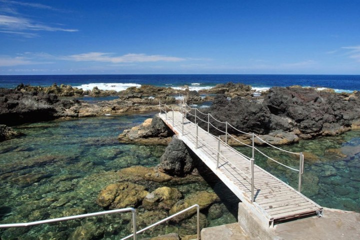 a wooden bridge over a body of water