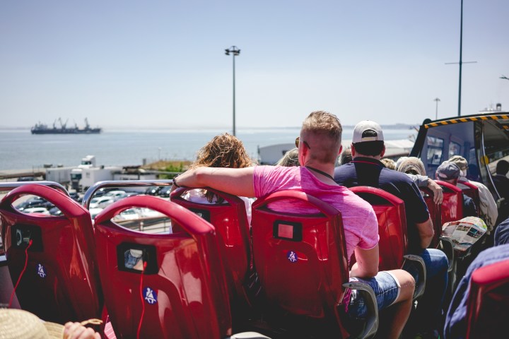 a group of people riding on the back of a truck