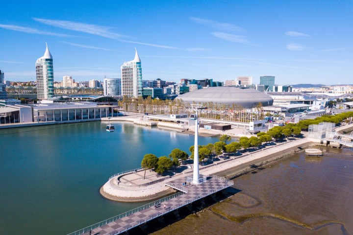 a body of water with a city in the background