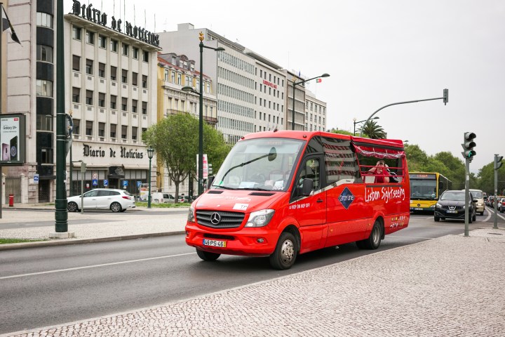 a truck that is driving down the street