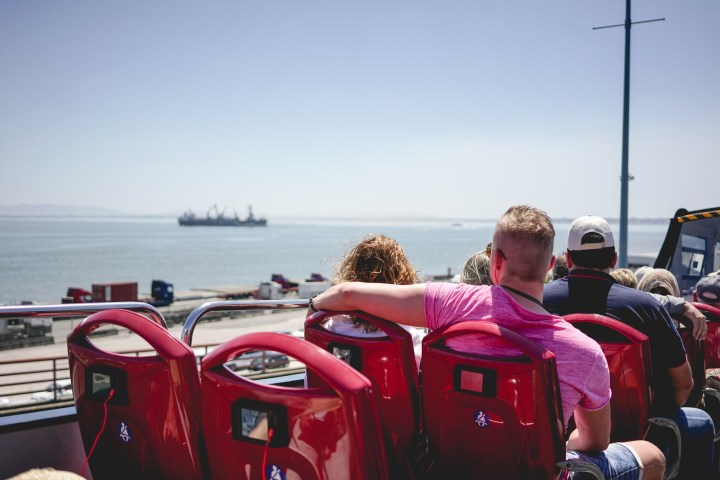 a person sitting next to a body of water