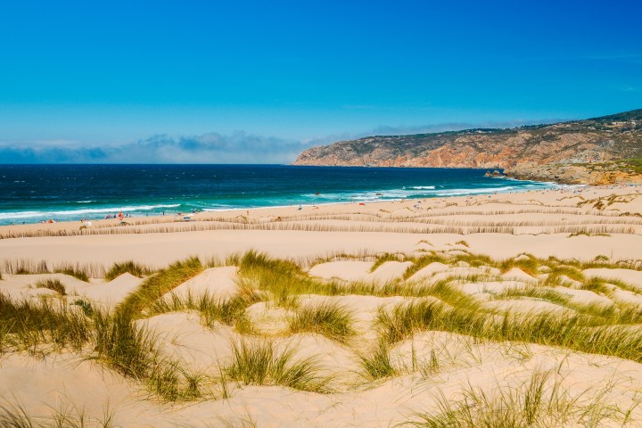 a beach next to the ocean