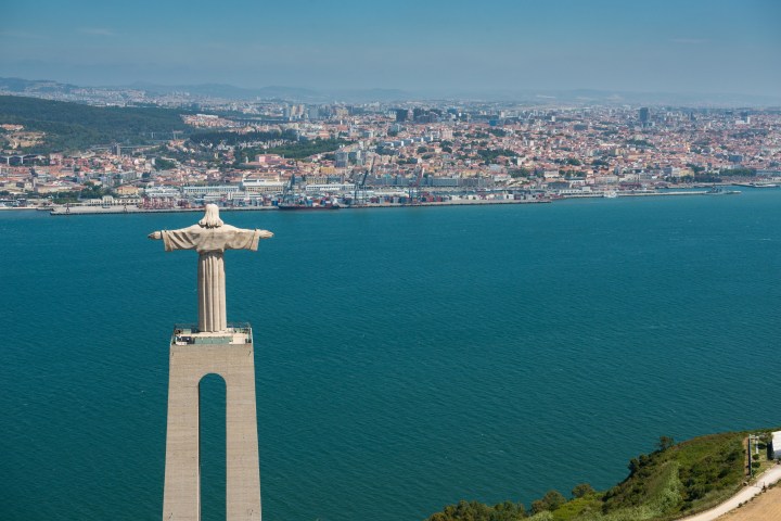 a large body of water with a city in the background