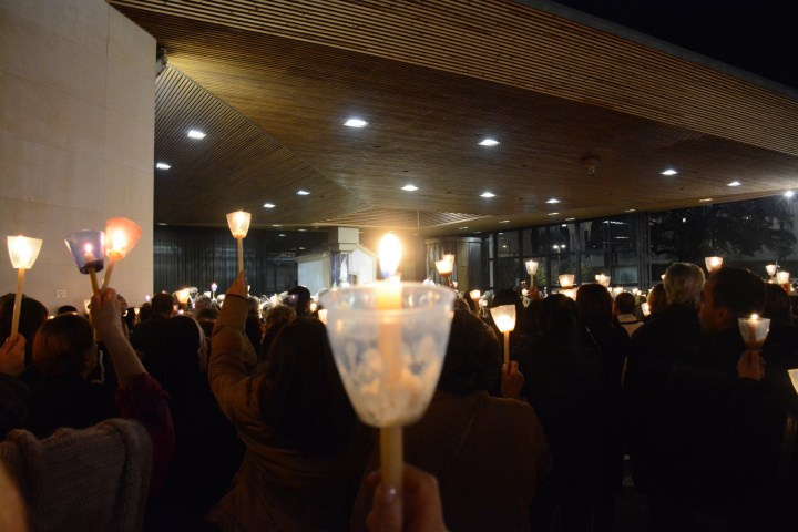 a group of people sitting at a table with wine glasses