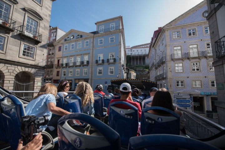 a group of people sitting in front of a building