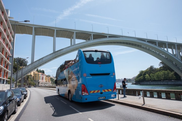 a bus traveling on a bridge