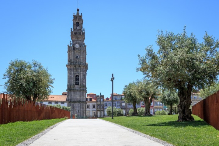 a clock tower in front of a brick building