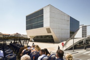 a group of people standing in front of Figge Art Museum