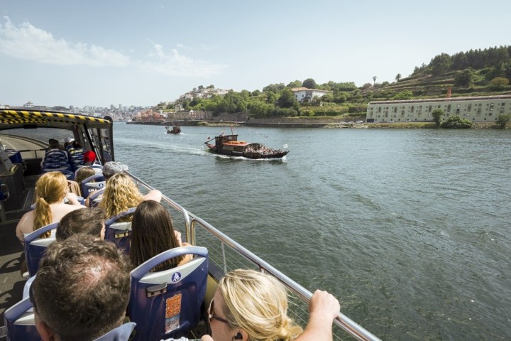 a group of people in a boat on a body of water