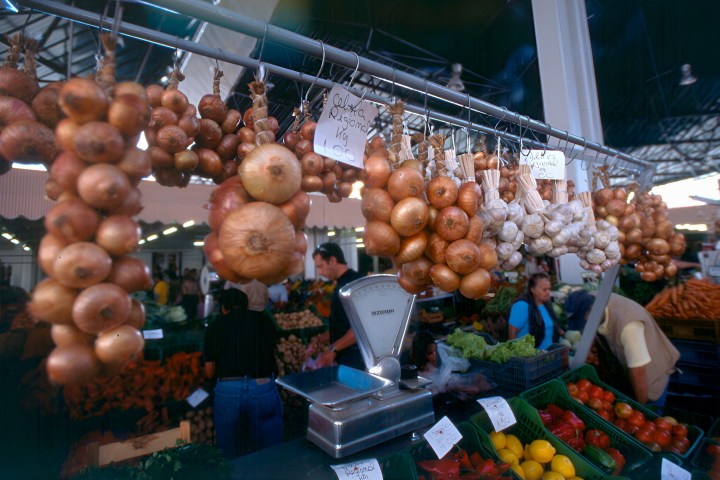 a variety of fruits and vegetables on display in a store