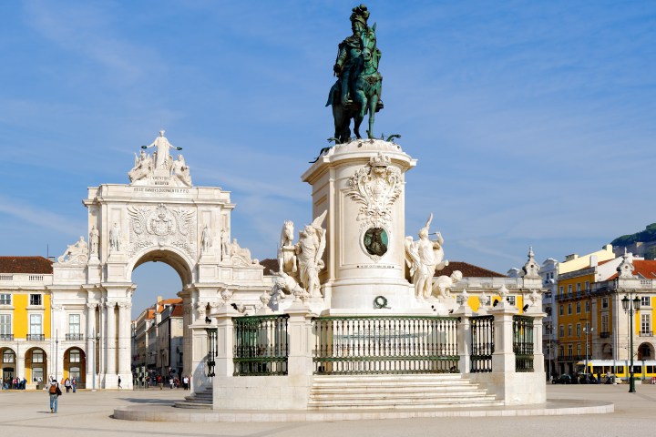 Praça do Comércio in Lisbon with an equestrian statue and arched monument.