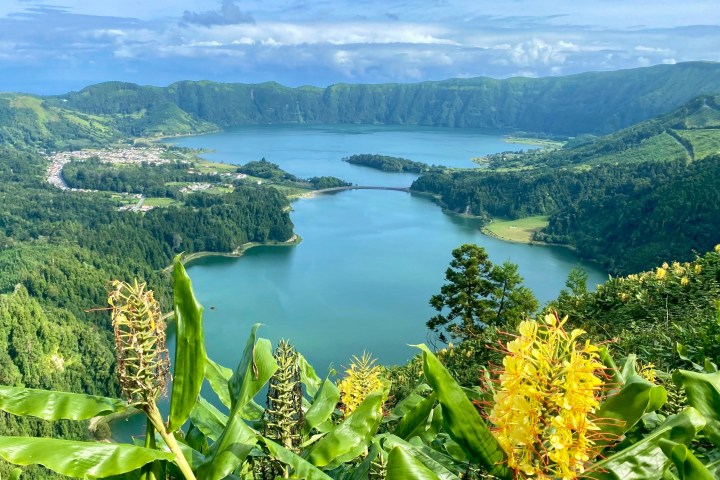 a large body of water with a mountain in the background